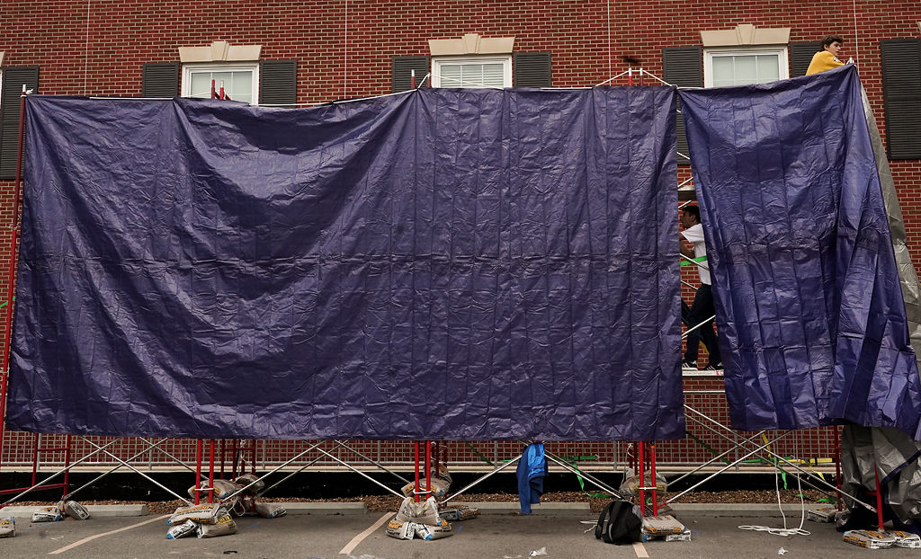 Phi Gamma Delta sets up tarps